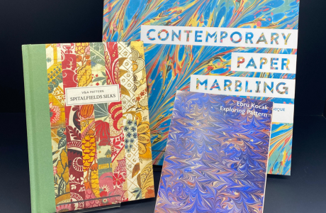 Art books and postcard packet inspired by marbling and patterns from our Exploring Patterns collection display.