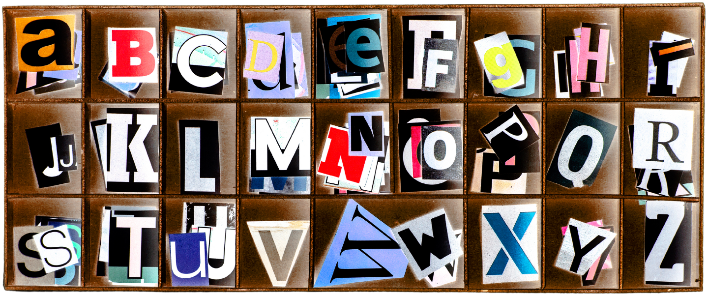Cut out letters organised in a wooden box