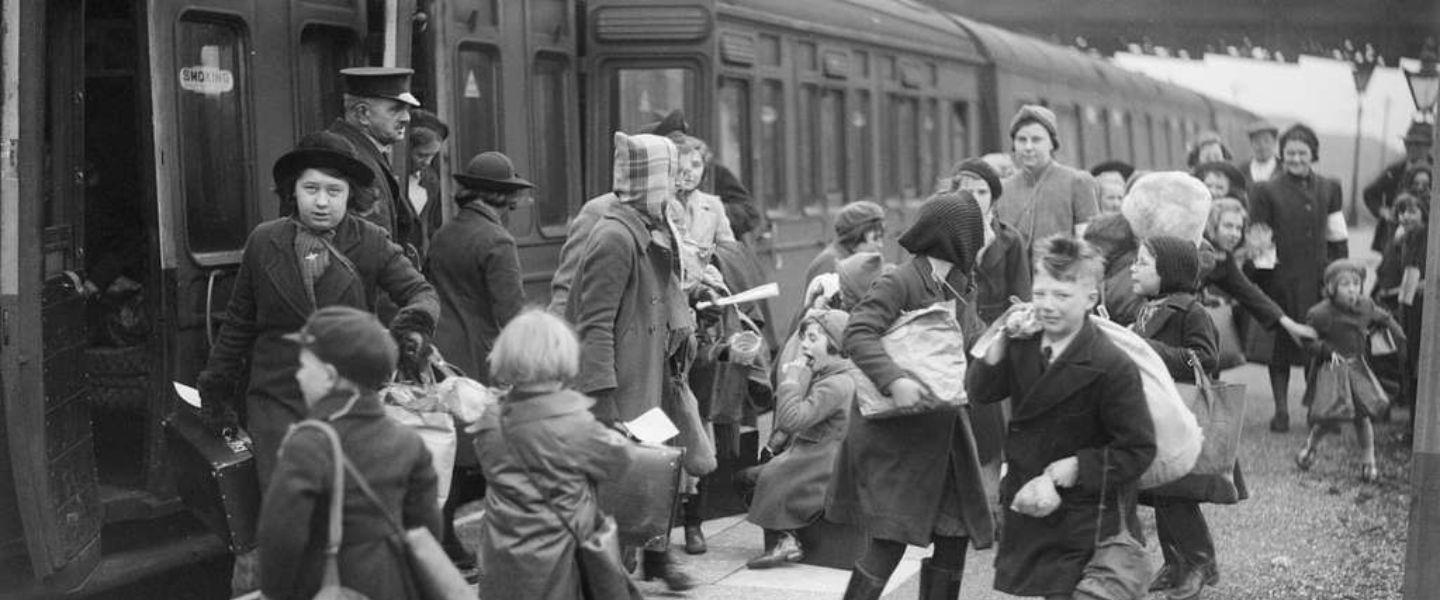 1940's evacuee children getting on a train. 
