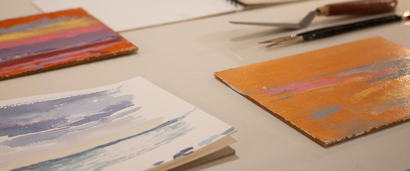 Sarah Butterfield's sketchbooks laid out on a table