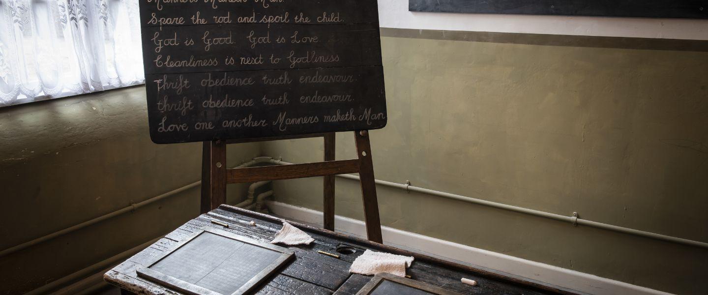 A blackboard in a Victorian school room